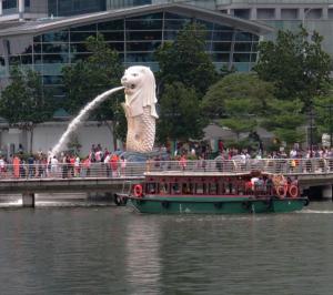 Merlion with an old ferry